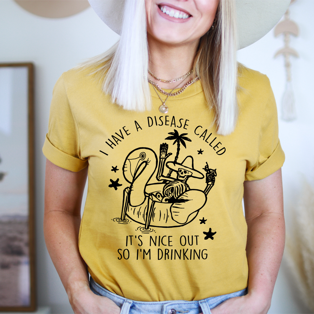 Mustard yellow graphic T-shirt with cactus drink illustration and slogan