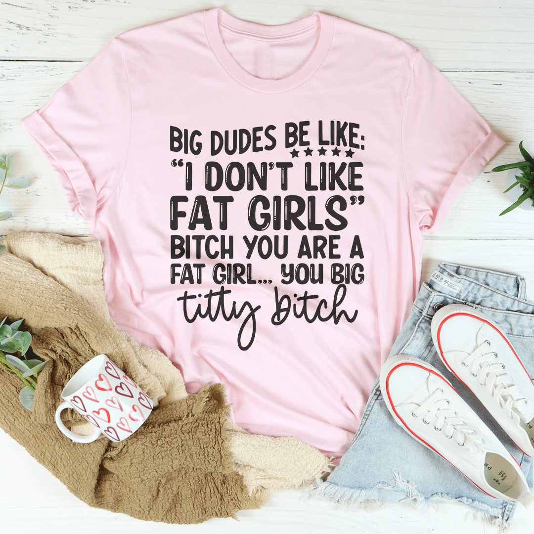 Pink crew-neck T-shirt with bold quote graphic and script "titty bitch"