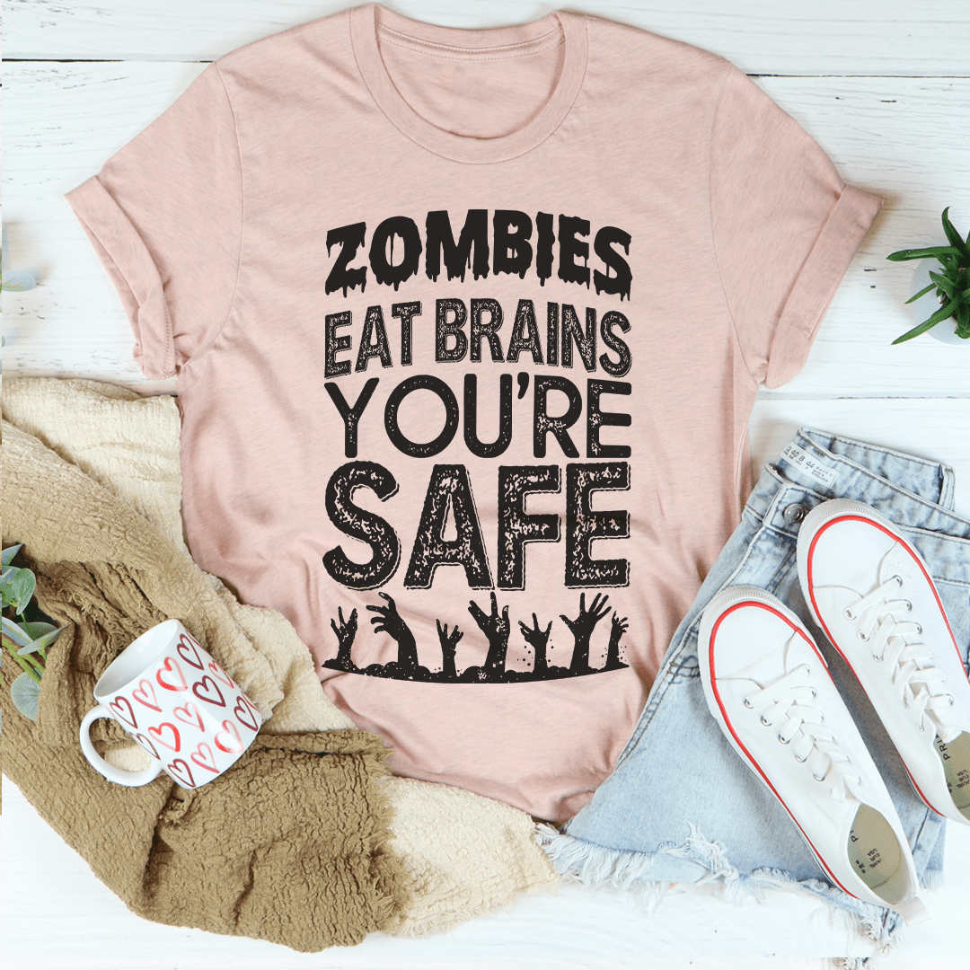 Dusty pink crewneck t-shirt with Zombies Eat Brains You’re Safe typography graphic