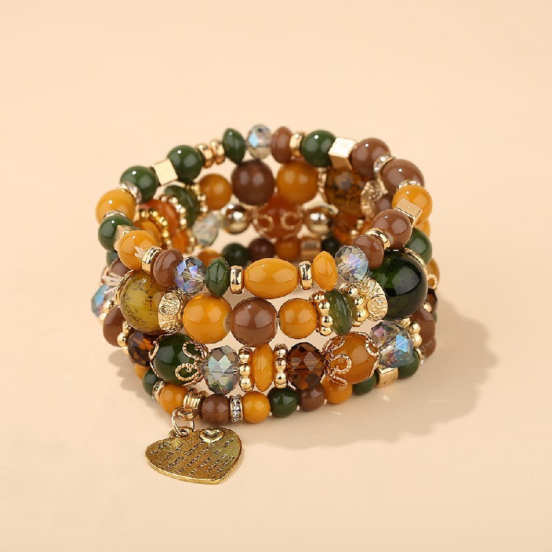 Heart charm bead layered bracelet set with green and gold-tone beads and heart pendant