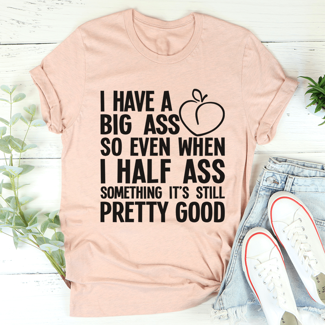 Peach crew-neck T-shirt with black quote text and heart graphic on front
