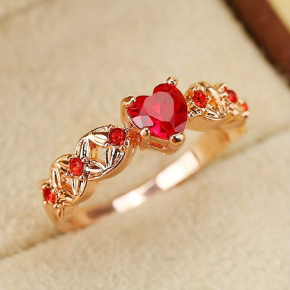Rose gold heart zircon promise ring with deep red center stone and matching side gems