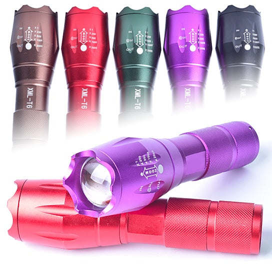 Zoomable focusing flashlight lineup featuring a purple flashlight in front and a red flashlight beneath.