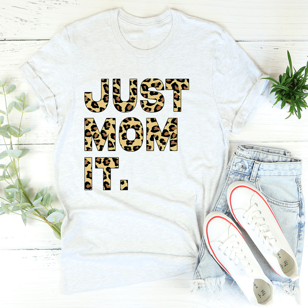 Women's white graphic T-shirt with leopard-style 'JUST MOM IT!' lettering