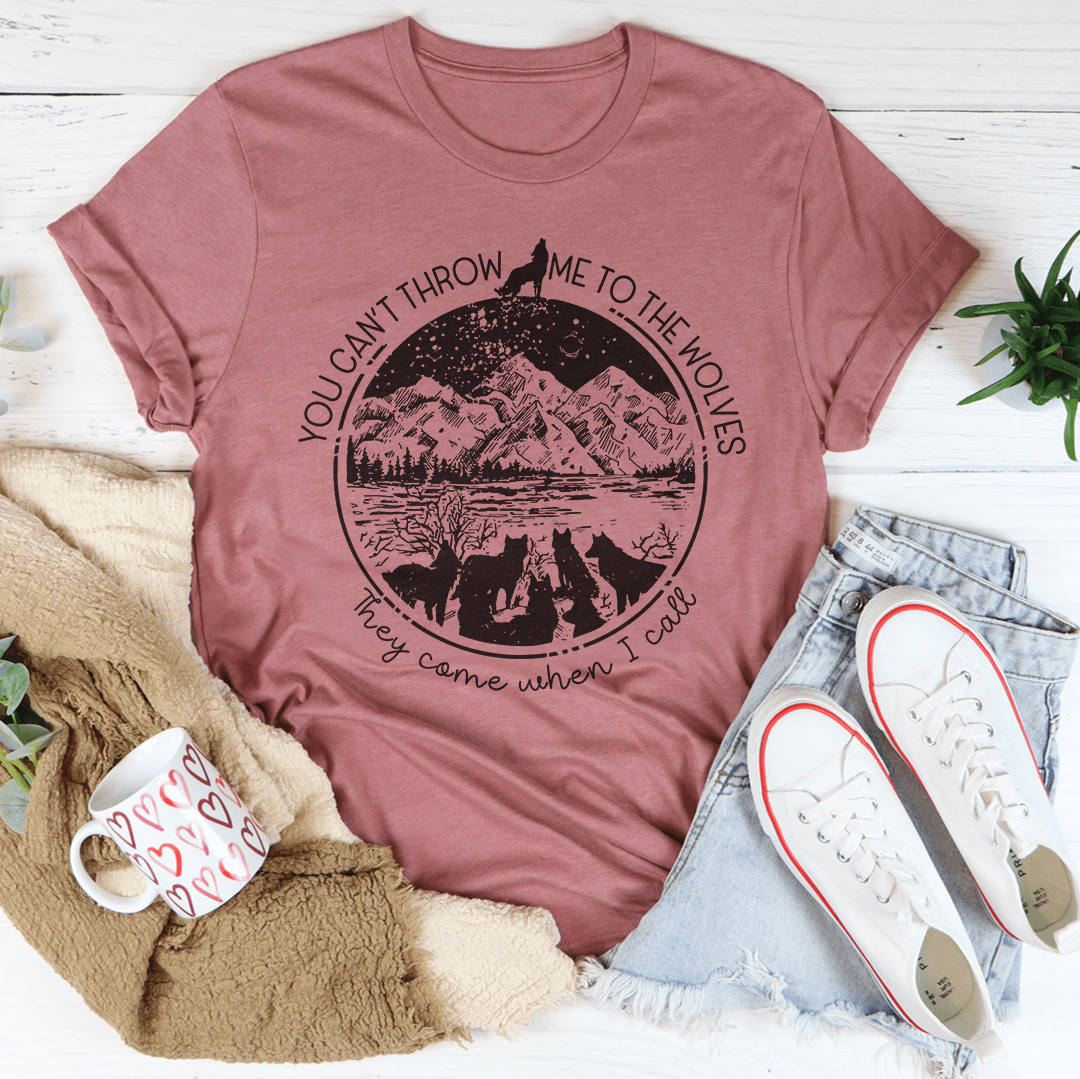 Mauve crewneck T-shirt with circular mountain-and-wolves graphic, flat lay
