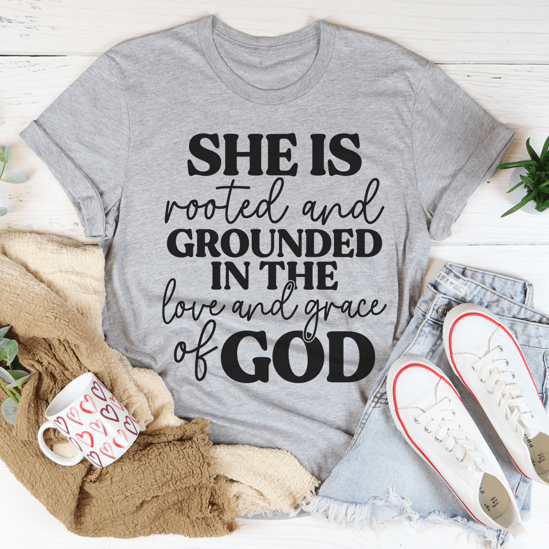Grey crewneck faith T-shirt with black 'SHE IS rooted and grounded...' text