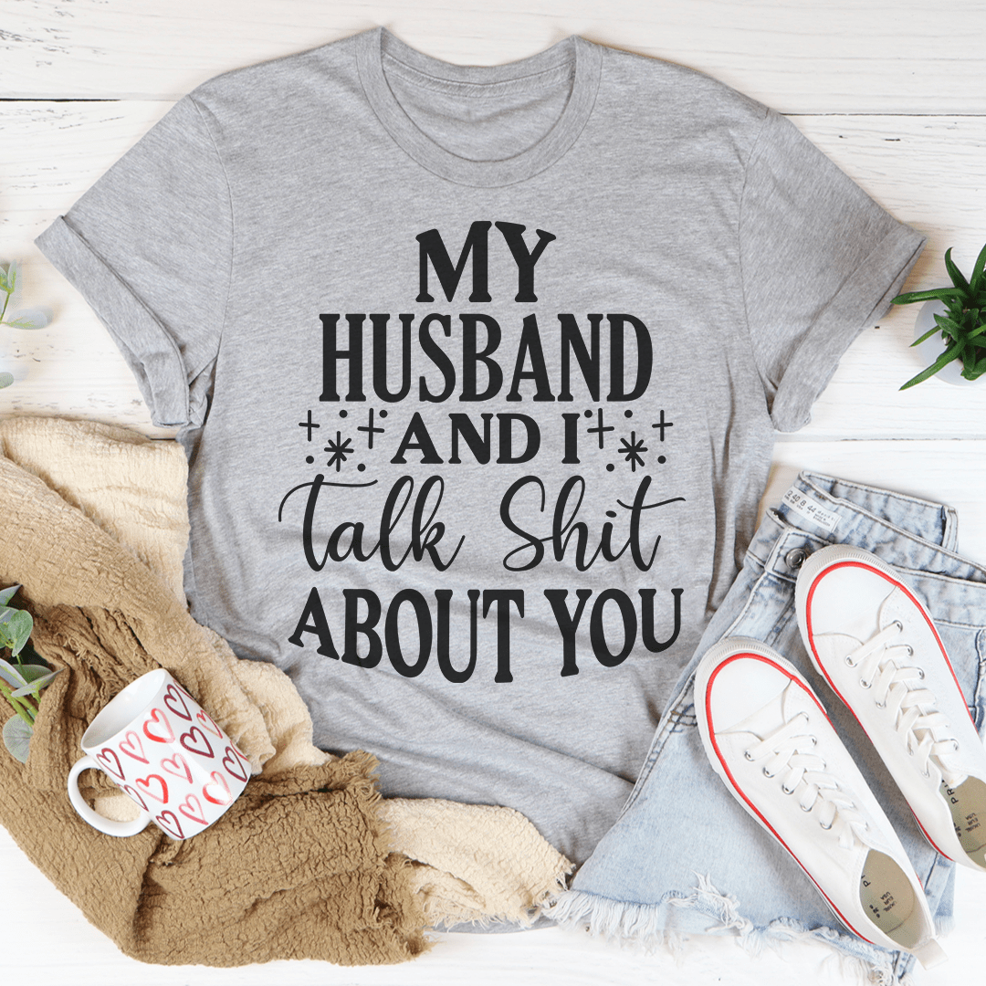 Grey crewneck T-shirt with bold text graphic: “My Husband and it talk Shit about you”