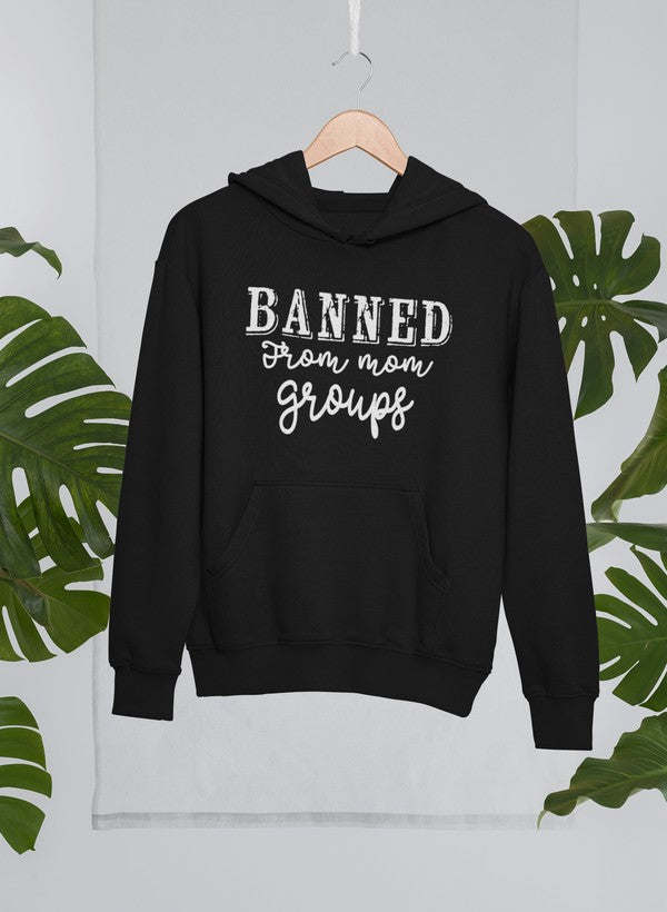 Black hoodie with kangaroo pocket and “BANNED from mom groups” graphic on front.