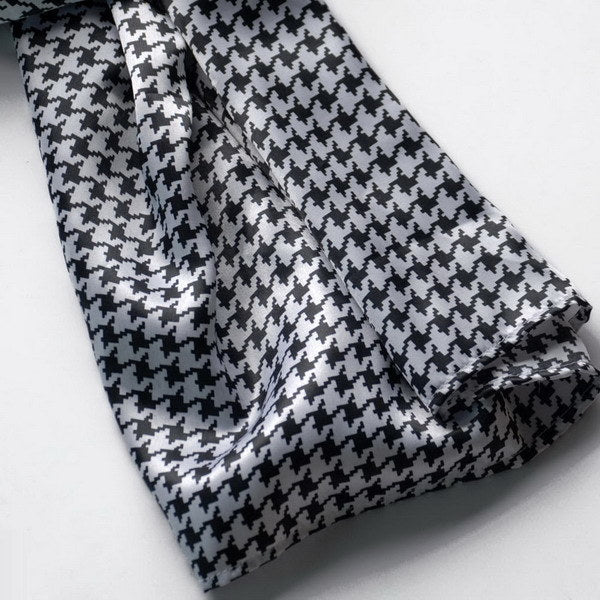 Silk scarf detail in black and white houndstooth plover weave pattern