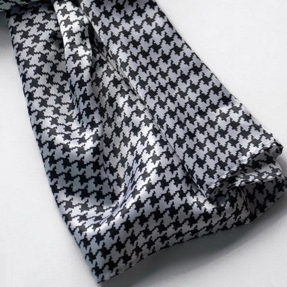 Silk scarf detail in black and white houndstooth plover weave pattern