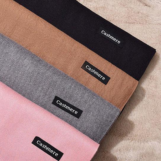 Cashmere blend wool scarf in black, tan, gray, and pink with 'Cashmere' labels