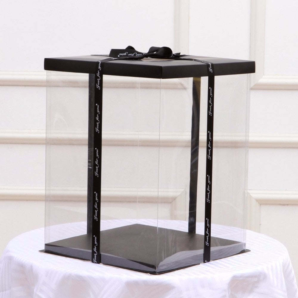 Black gift display box with satin ribbon and bow, clear window top view.