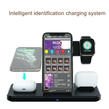 Black wireless charging dock with phone, smartwatch, and two wireless earbuds
