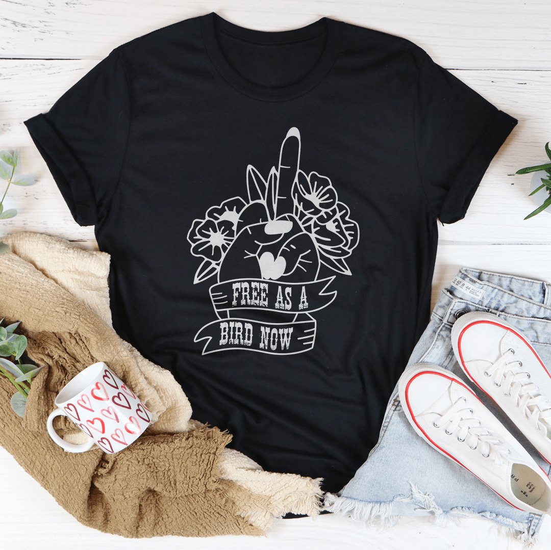 Black crew-neck T-shirt with 'Free as a Bird Now' lion graphic.