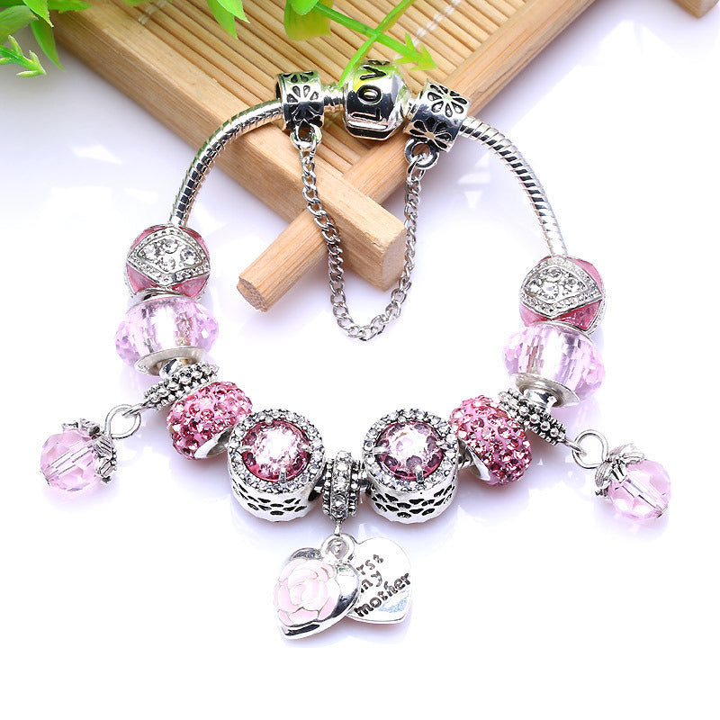 Silver charm bracelet with pink rhinestone beads, heart dangle charm and love tag
