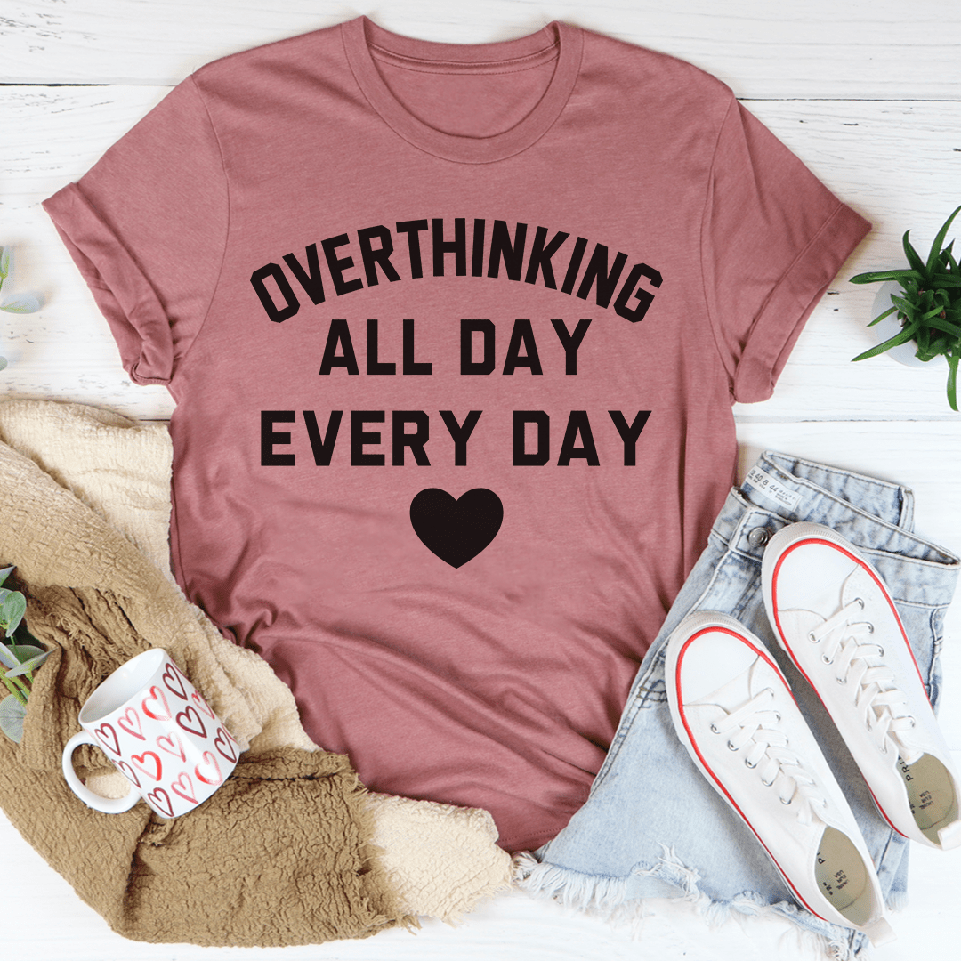 Pink crew-neck T-shirt with 'OVERTHINKING ALL DAY EVERY DAY' and small black heart print.