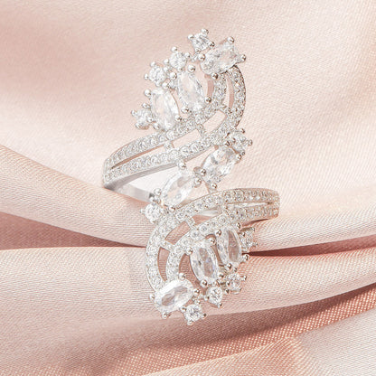 Silver-toned halo ring with oval clear center stone and sparkling side details