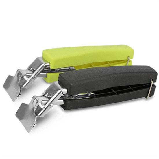 Hot pot picker with green handle, black base, and silver prong claw