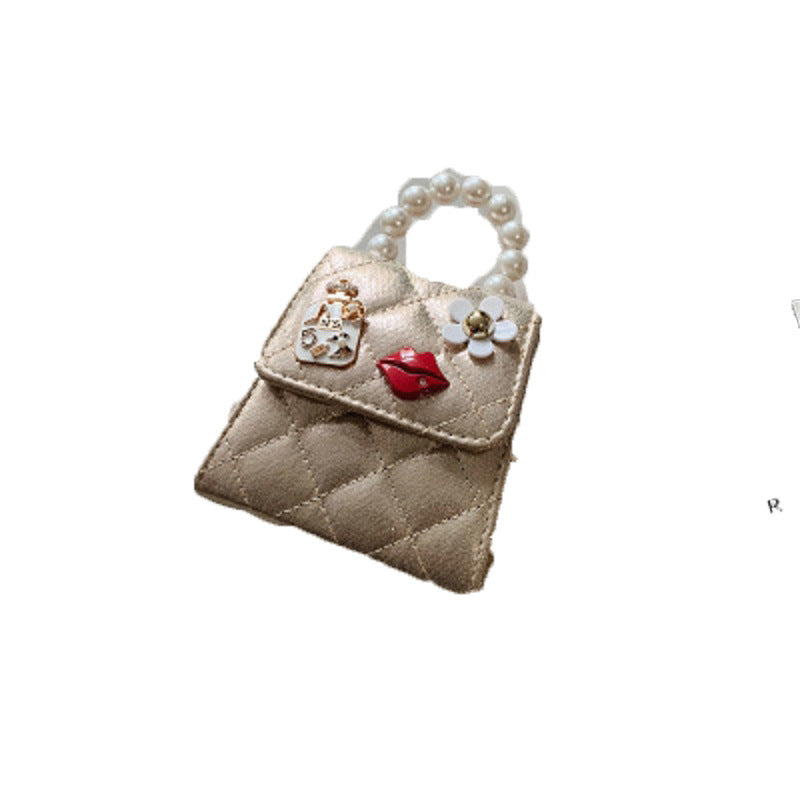 Beige quilted envelope mini bag with pearl top handle and flower, lip, and key charms