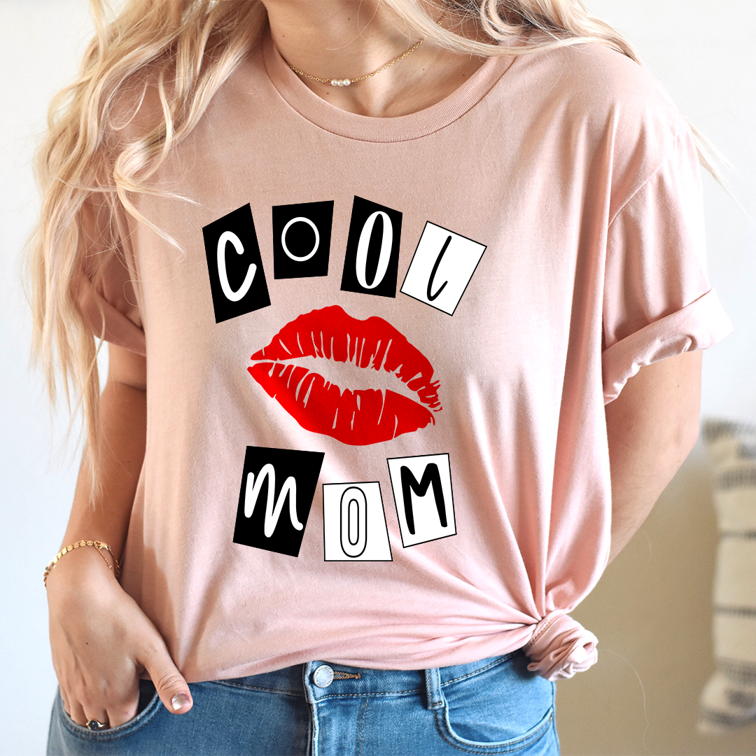 Pink crewneck T-shirt with red lips and 'COOL MOM' graphic