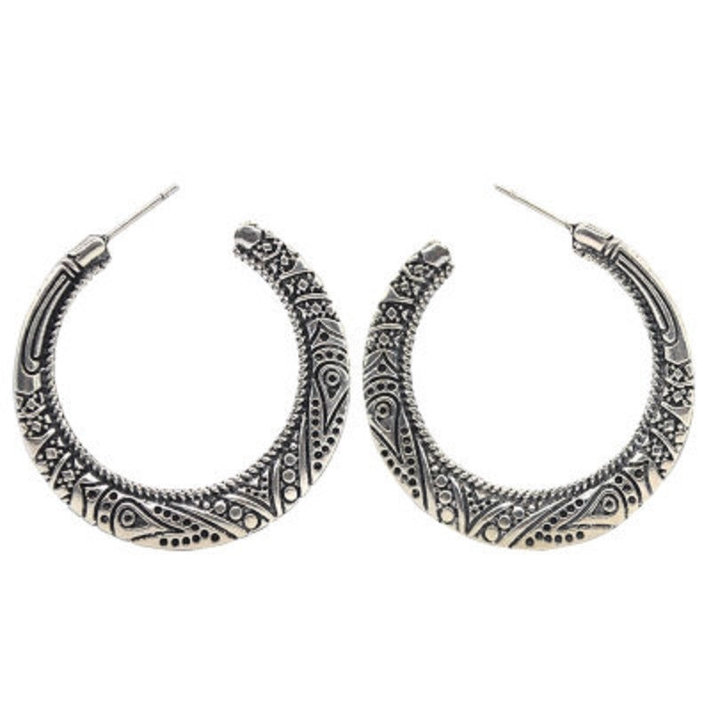 Silver-tone hoop earrings with engraved dome half-ring and decorative dot scrolls
