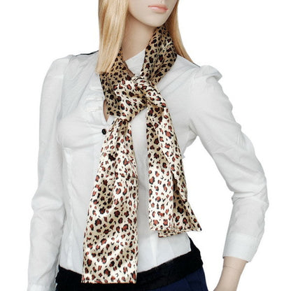 Leopard print neck scarf in brown and cream, tied at collar
