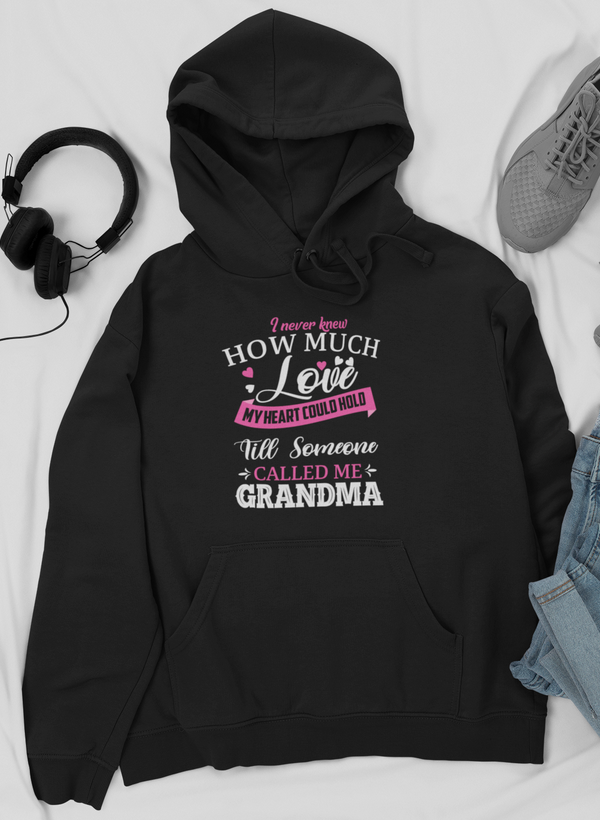 Black pullover hoodie with front pocket, hood drawstrings, and Grandma message print