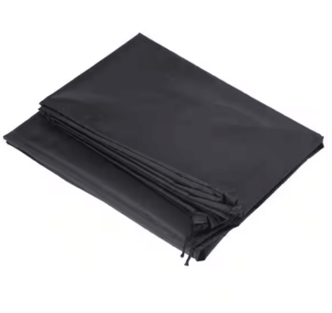 Folded black square fire pit cover with side ties and stitched seams