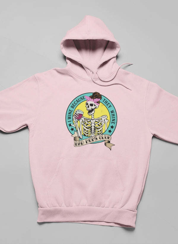 Pink pullover hoodie with front circular skeleton holding wine graphic