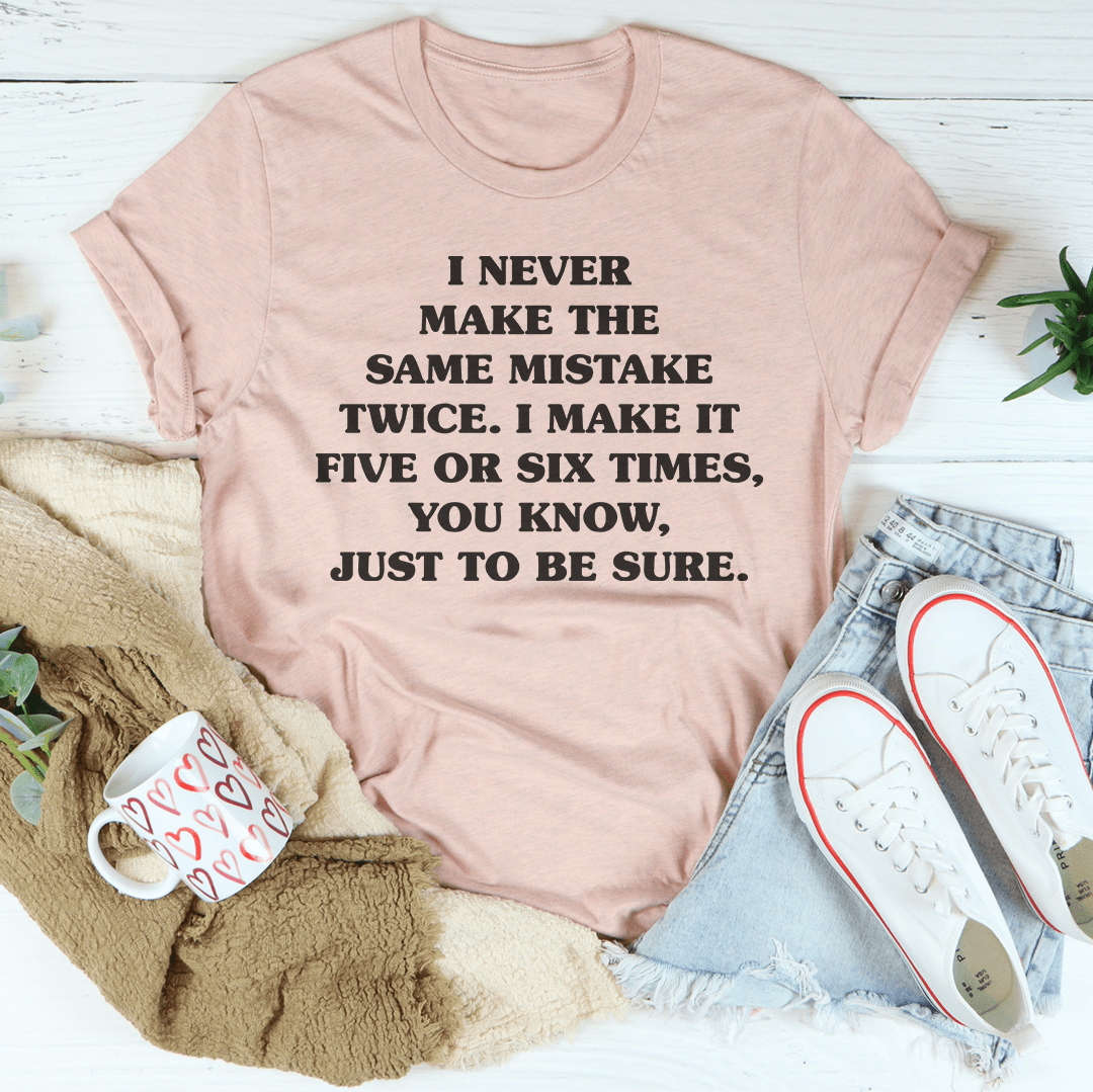 Mauve crewneck T-shirt featuring centered black quote text.