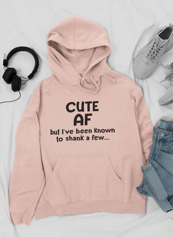 Light pink pullover hoodie with bold graphic text, front kangaroo pocket, and hood strings