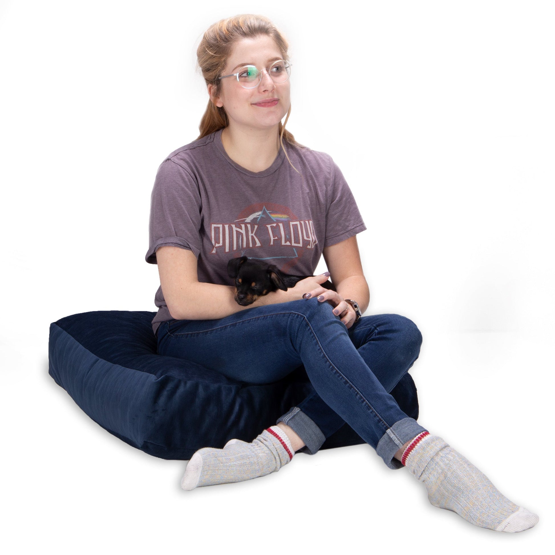 Indigo plush floor cushion with thick profile and rounded corners, side view
