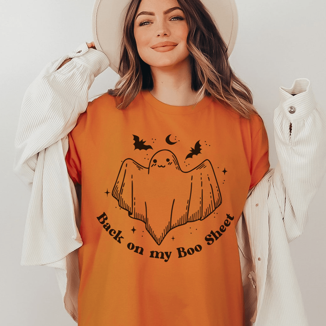 Orange crewneck T-shirt featuring a ghost graphic and "Back on my Boo Sheet"