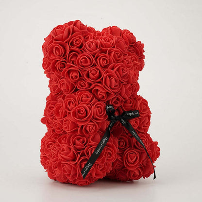 Red rose teddy bear with black bow ribbon at the front