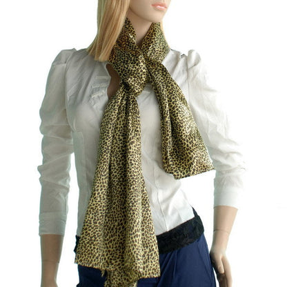 Leopard-print silk scarf worn long, olive and tan with softly ruffled ends