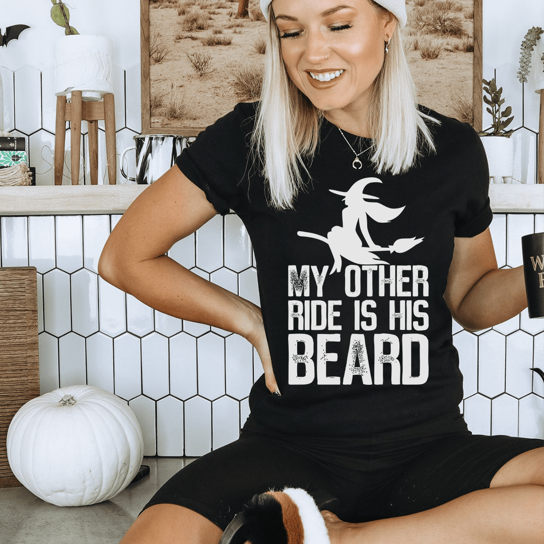 Black crewneck T-shirt with bearded rider graphic and "MY OTHER RIDE IS HIS BEARD" text