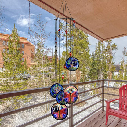 Hanging blue metal wind chime with three round Tree of Life discs and red/blue beads