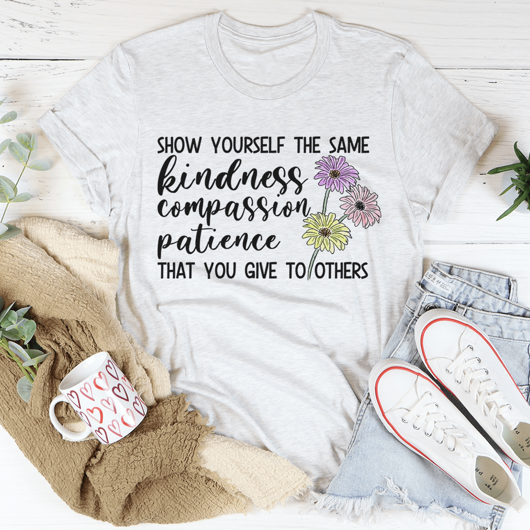 Light gray crewneck T-shirt featuring front lettering and flower illustration