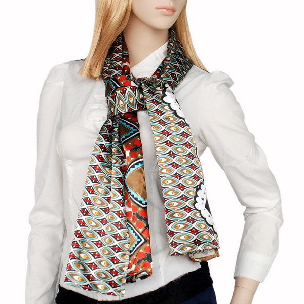 Patterned scarf worn around neck; brown, black, red and teal with medallion border