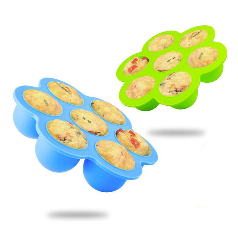 Blue and green silicone 7-cavity egg bite molds with filled cups