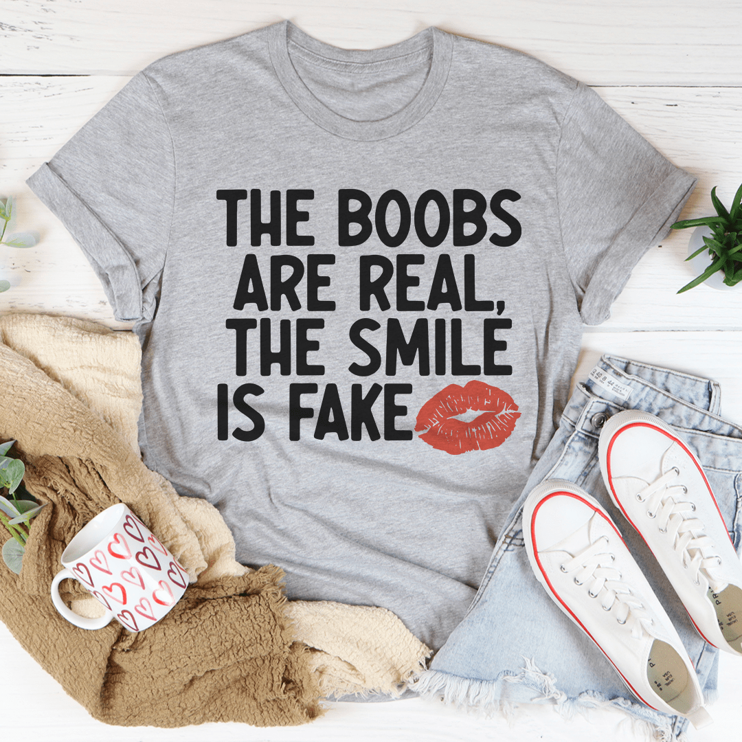 Athletic heather gray crew-neck T-shirt with bold quote 'THE BOOBS ARE REAL' and red lips