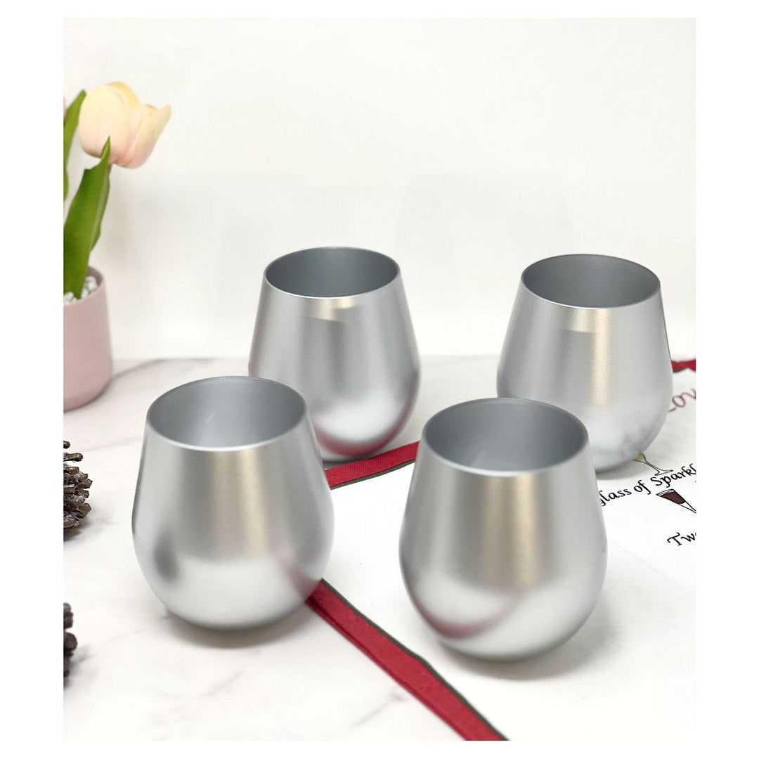 Set of four metallic silver plastic wine glasses, stemless goblet shape