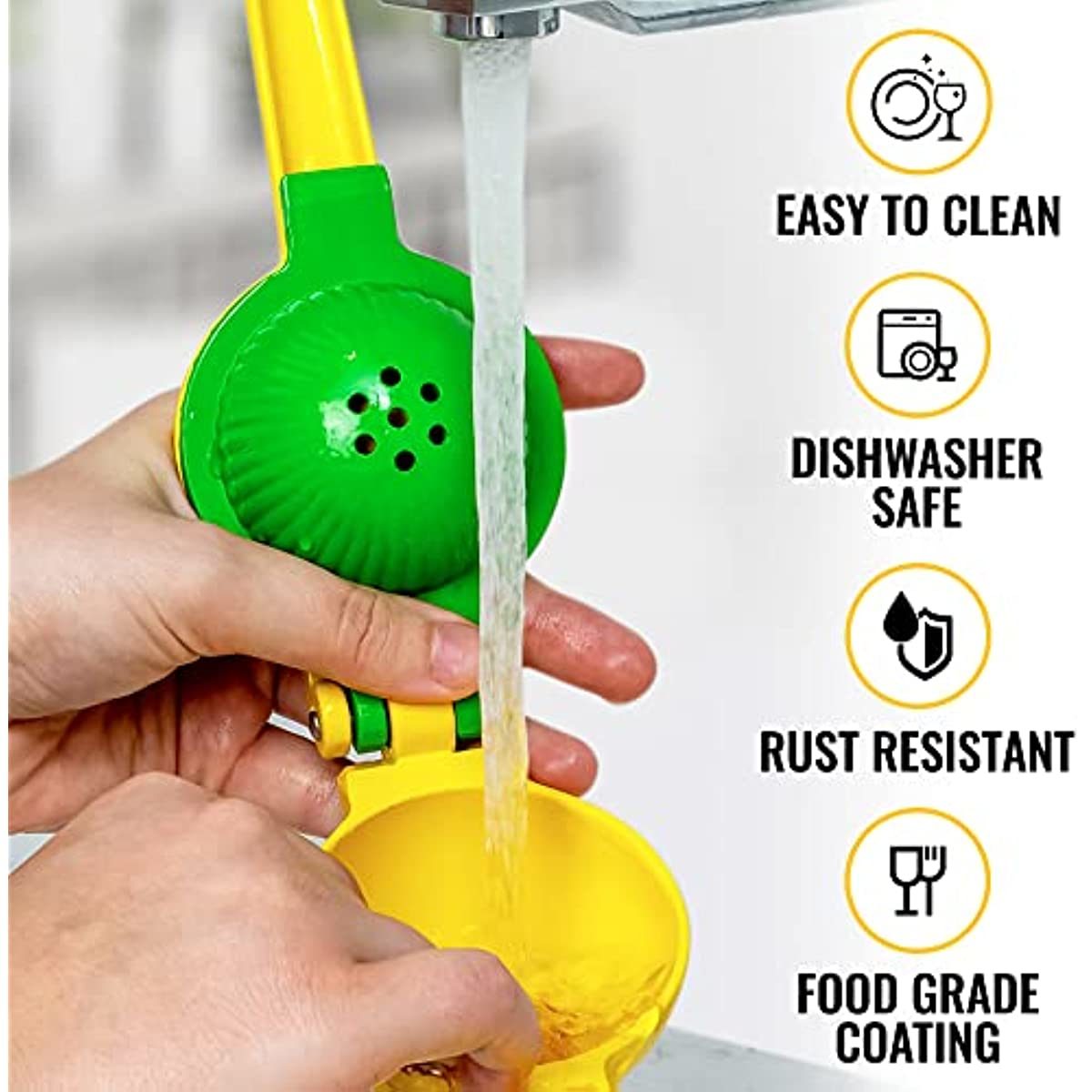 Yellow citrus juicer with perforated green cone being rinsed with water