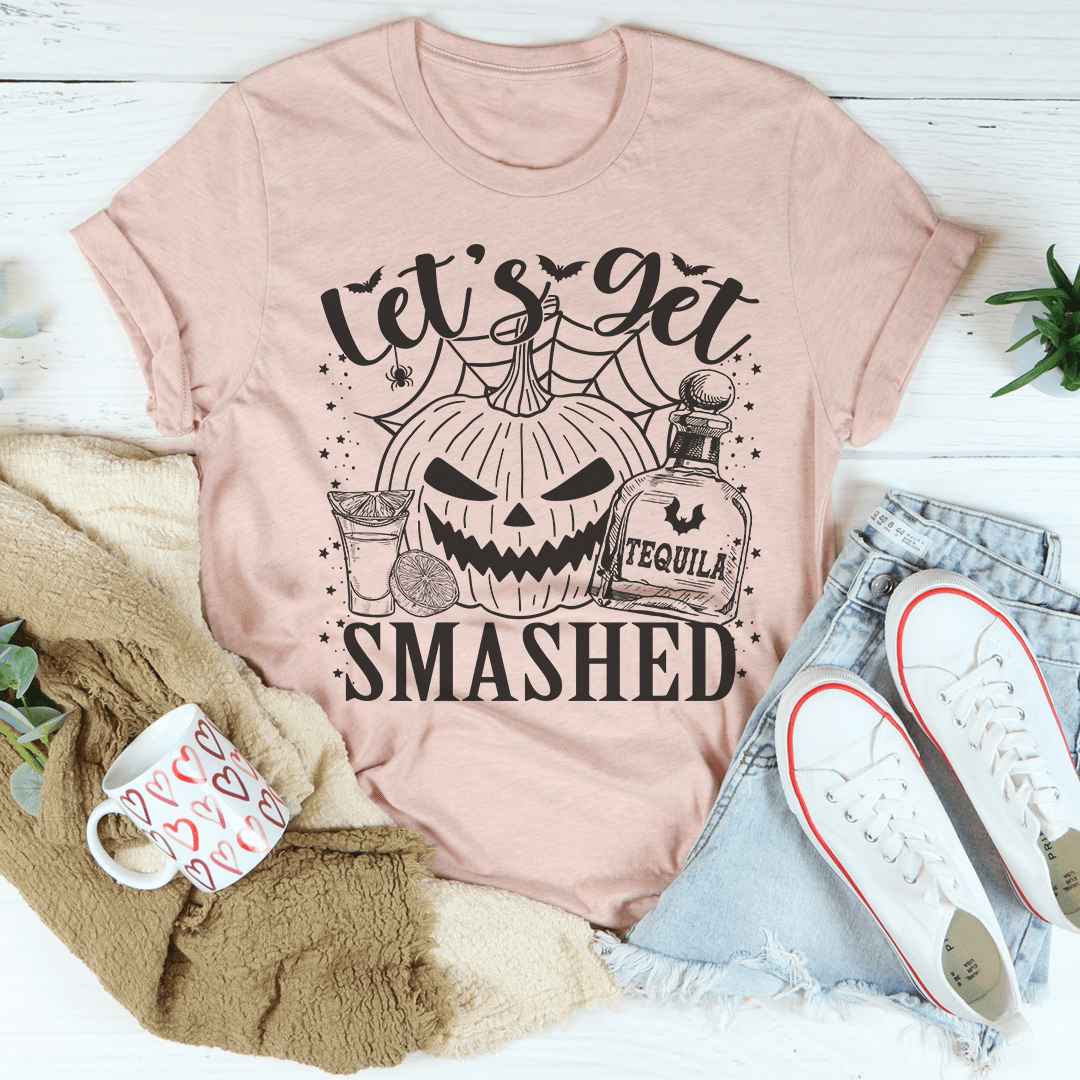 Dusty pink pumpkin graphic T-shirt with 'SMASHED' text and drink-themed artwork.