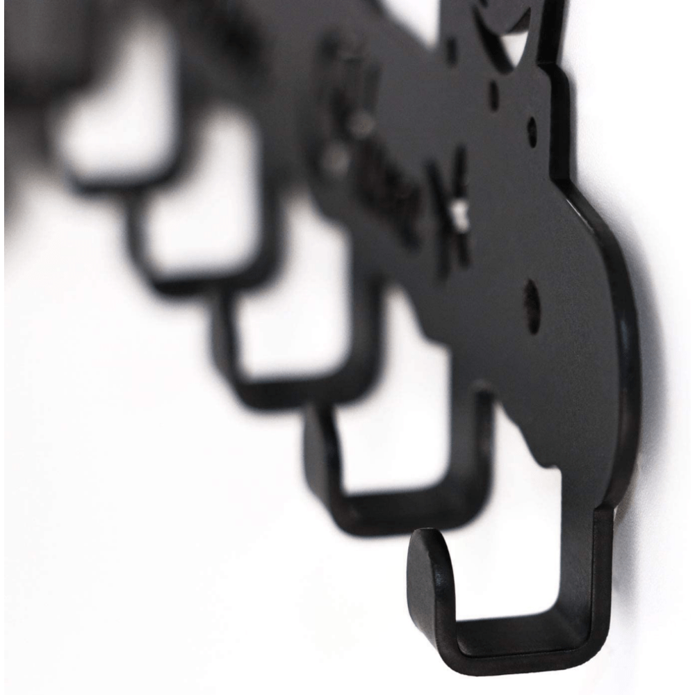 Black key hanger close-up showing curved hooks and cutout rose details
