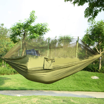 Outdoor hammock swing with mosquito net canopy, green fabric and side suspension ropes