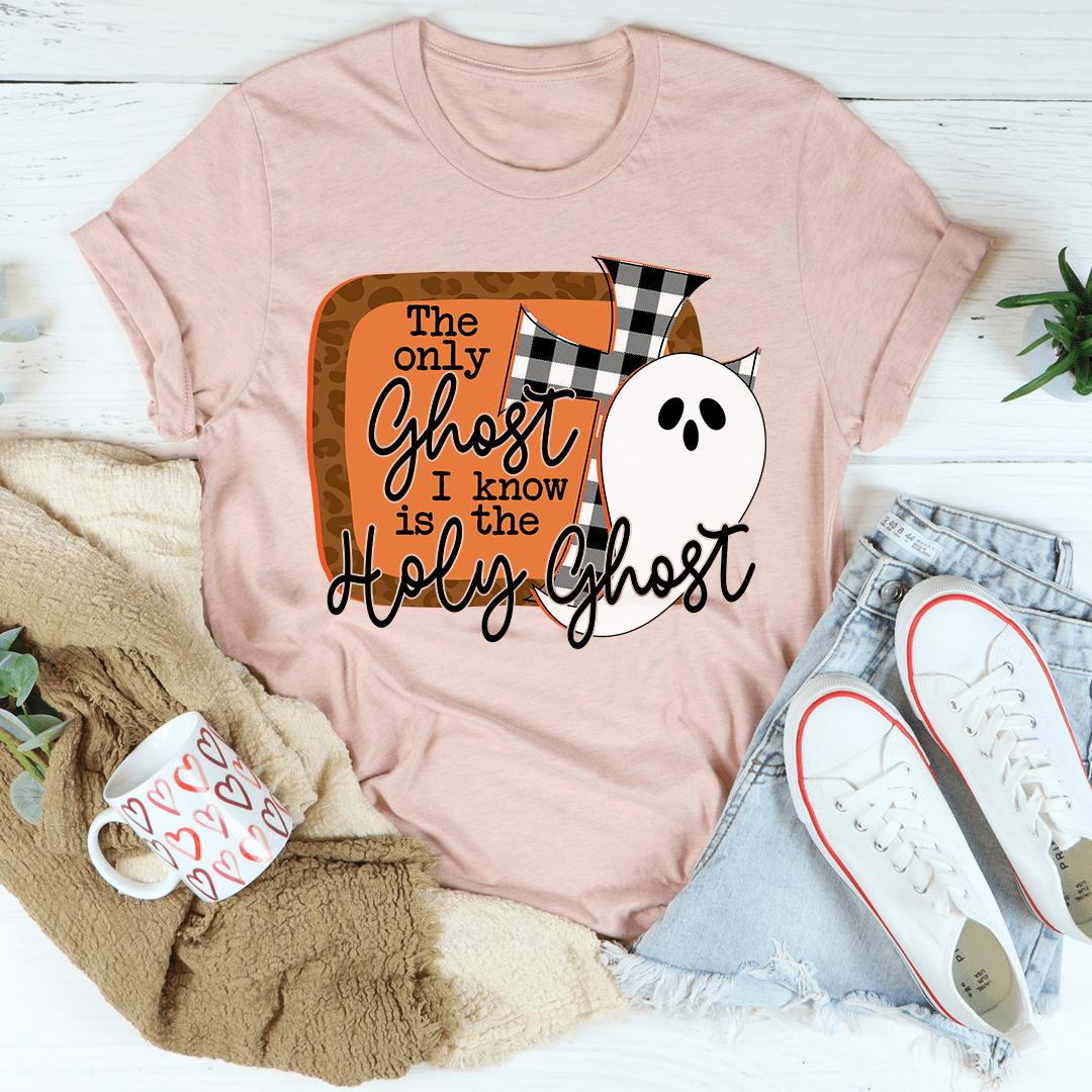 Heather pink T-shirt with cartoon ghost face and black-orange text graphic on front.