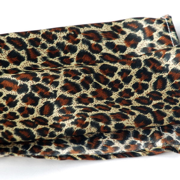 Large silk fabric scarf in leopard print, tight spots in dark brown, cream, and rust
