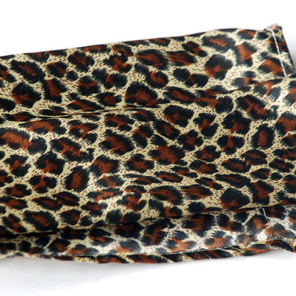 Large silk fabric scarf in leopard print, tight spots in dark brown, cream, and rust