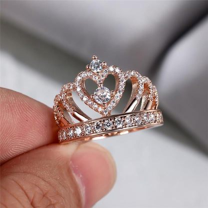 Rose gold heart crown ring close-up with clear stones and pavé front band.